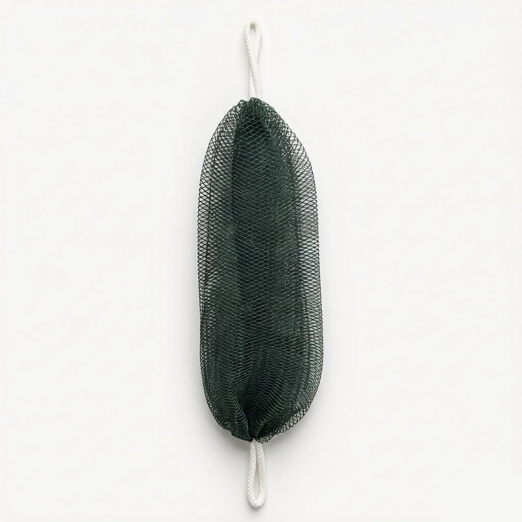 Dark green MOKALUN African net bath sponge with hanging loops on a light background